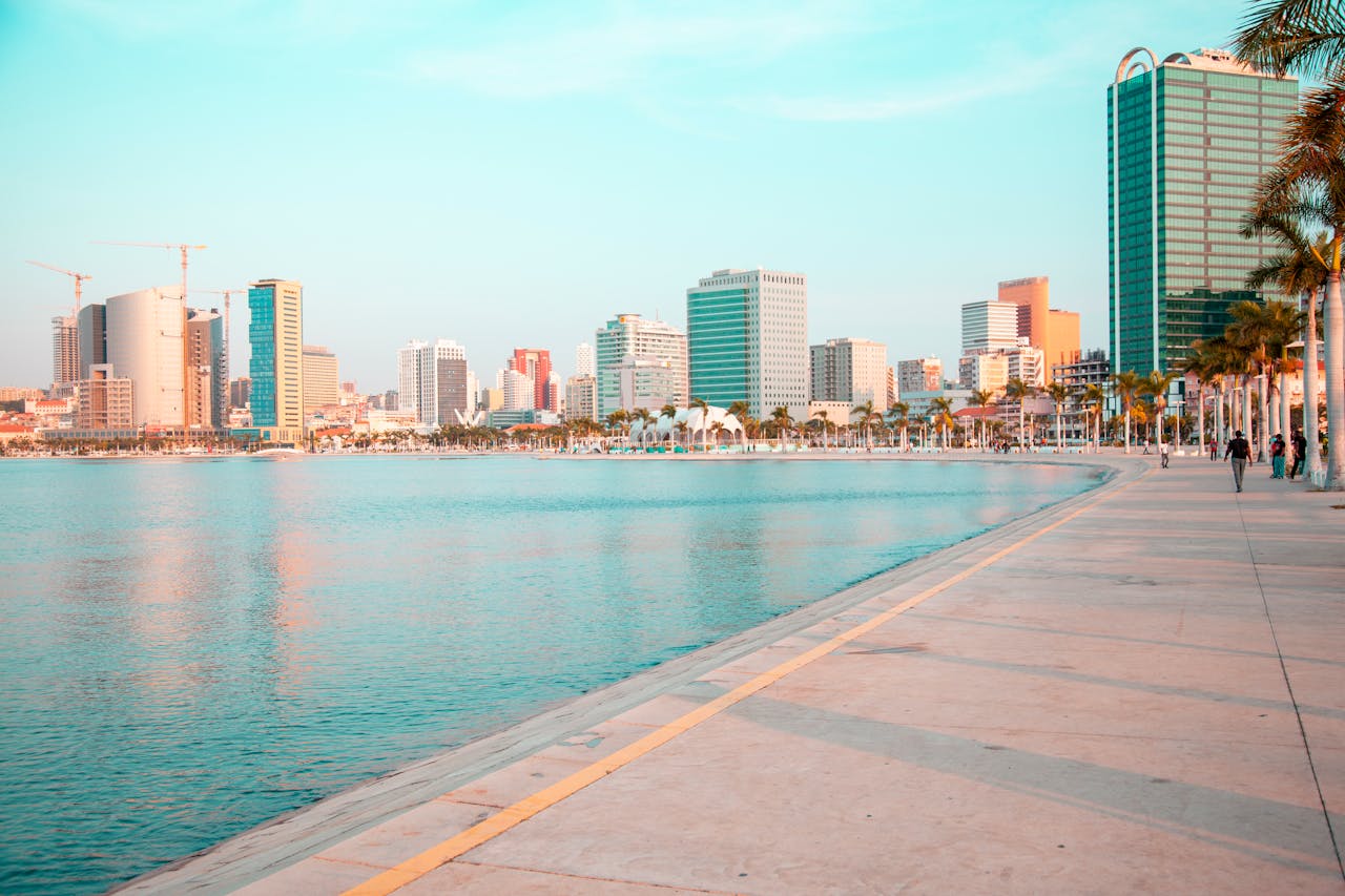 Scenic view of Luanda's modern skyline along the waterfront promenade in Angola.