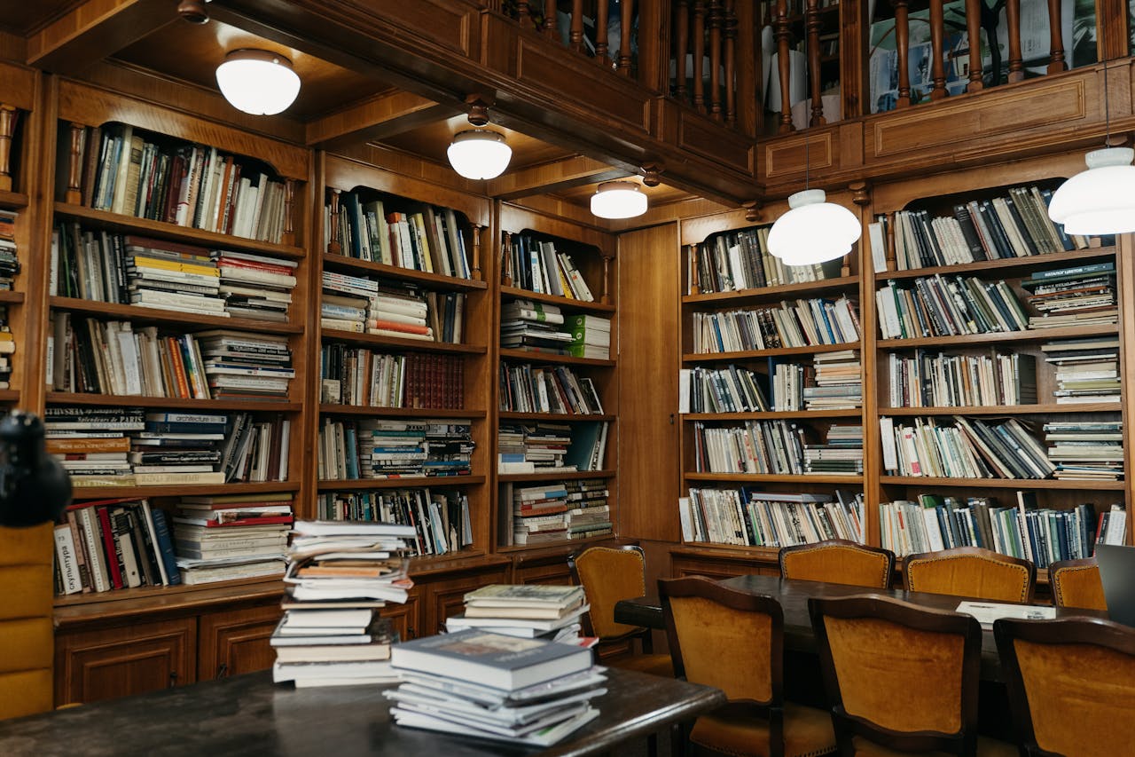Warm wooden library with stacked bookshelves, perfect for reading enthusiasts.